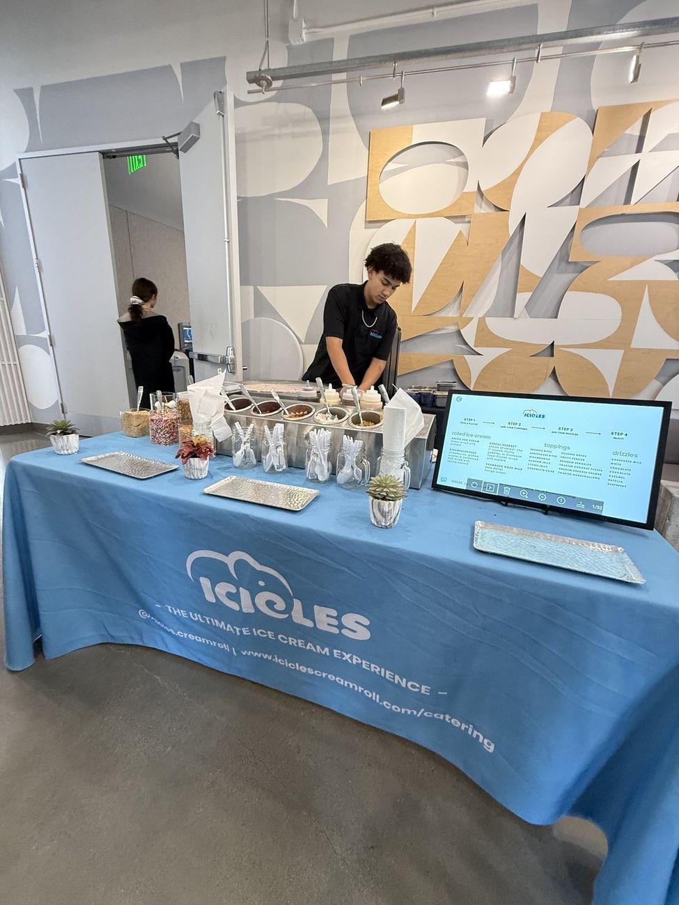The Icicles toppings bar set up poolside at an outdoor event